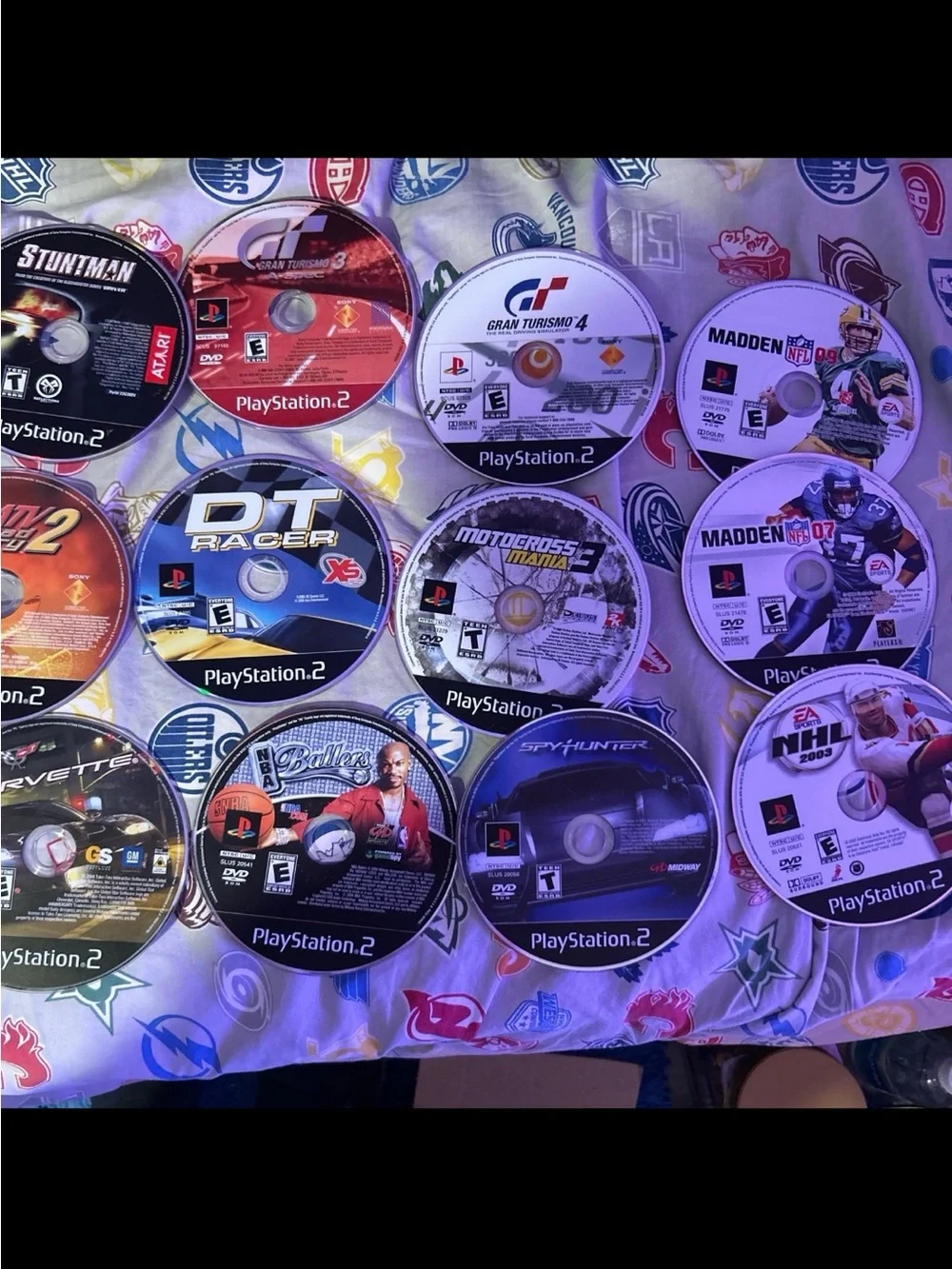 Sony PlayStation 2 Slim Bundle with Black Console and Multicolored Game Discs